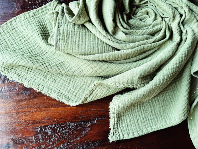 sage green baby swaddle
